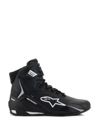 Alpinestars Stella Faster-4, damskie buty motocyklowe, czarno-białe, wysoka konstrukcja z logo Astars i paskiem na kostce, widok z boku