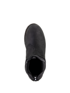 Alpinestars Turnstone Shoes, czarne, widok z góry na miejskie buty motocyklowe wykonane ze skóry bydlęcej, elastyczne wejście w stylu Chelsea, tylny uchwyt z białymi kropkami, minimalistyczne obuwie ochronne do użytku szosowego.