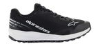 Buty Alpinestars Meta Road V2, czarne obuwie sportowe z grubą białą podeszwą, biały napis Alpinestars i logo gwiazdy, cholewka z teksturowanej siateczki, czarne sznurowadła, wytrzymała przyczepna podeszwa, lekki sportowy design do pracy w zespole wyścigowym i użytku codziennego