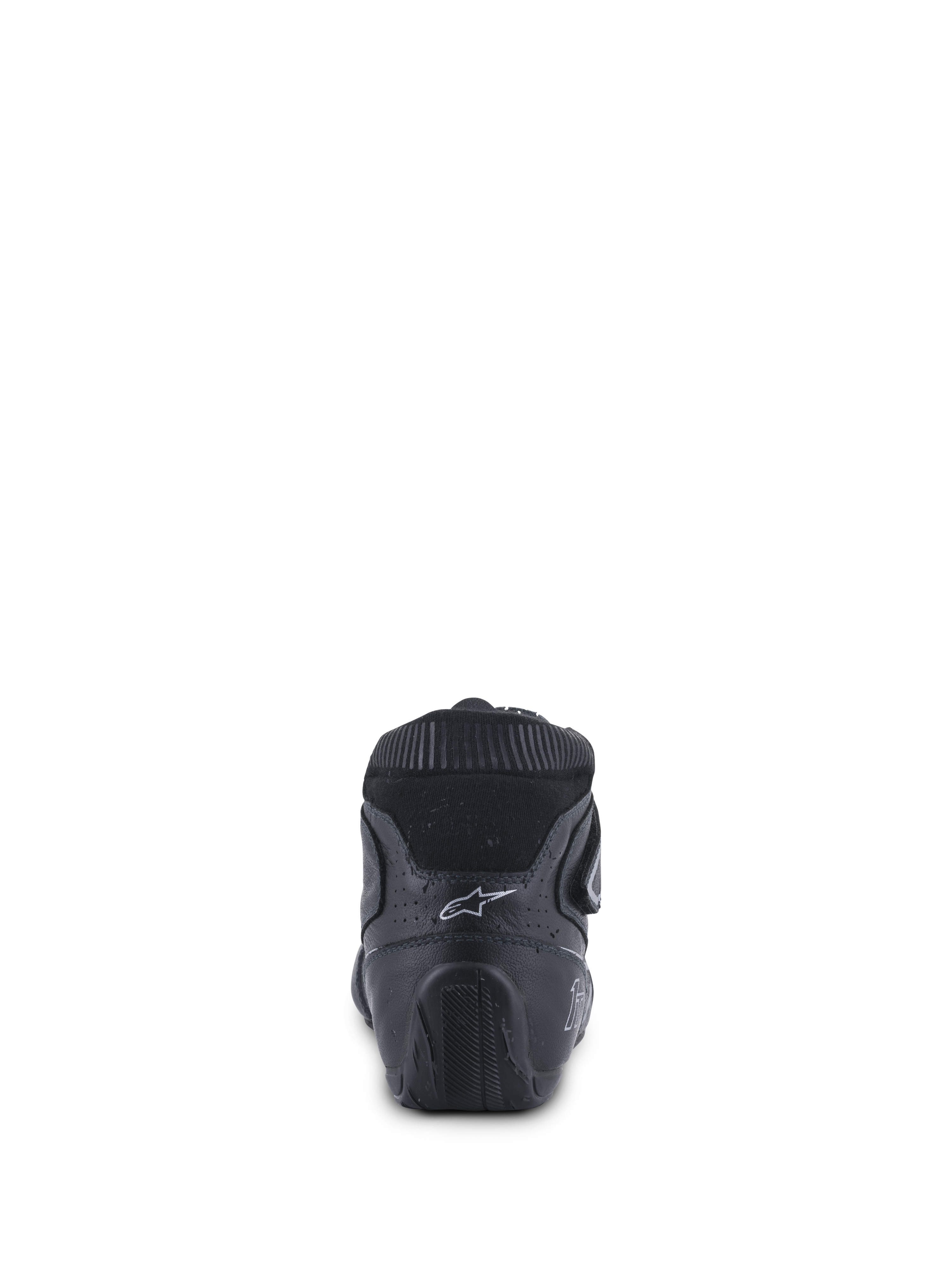 Alpinestars Tech-1 T V3 Shoes FIA, buty do profesjonalnych wyścigów samochodowych, czarne ze srebrnymi detalami, widok z tyłu przedstawiający ergonomiczne wzmocnienie pięty, białe logo Astars oraz teksturowaną gumową podeszwę zaprojektowaną dla lepszej kontroli pedałów.