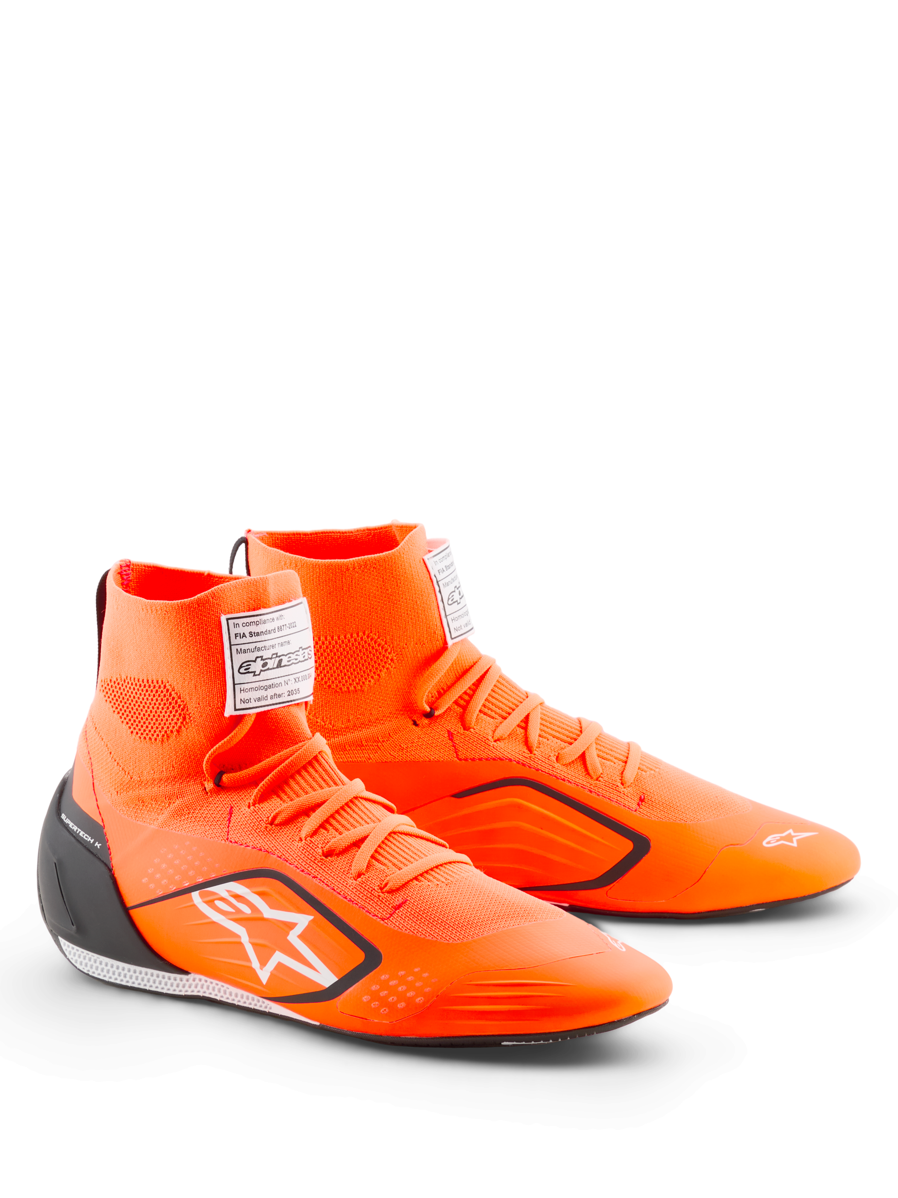 Alpinestars Supertech K Shoes - FIA, buty kartingowe, pomarańczowe fluo z czarnymi i białymi elementami, wysoka dziana cholewka, czarny zapiętek TPU, białe logo Alpinestars, etykieta certyfikacji FIA na języku
