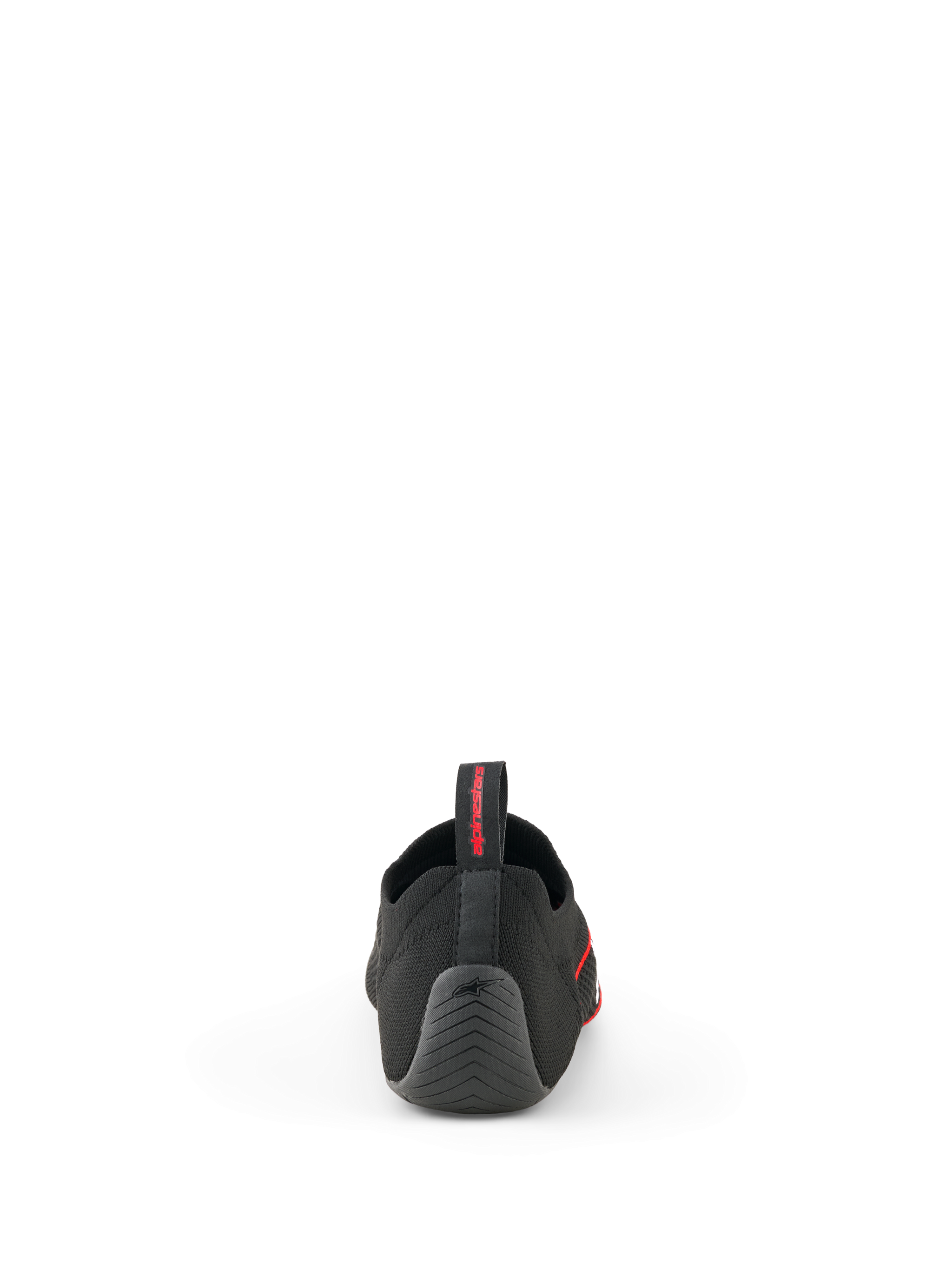 Buty Alpinestars Tech Gaming, czarne, widok od tyłu przedstawiający bezszwową dzianinową cholewkę, teksturowaną gumową piętę z logo gwiazdy i tylny uchwyt z czerwonym brandingiem, obuwie do SIM-racingu