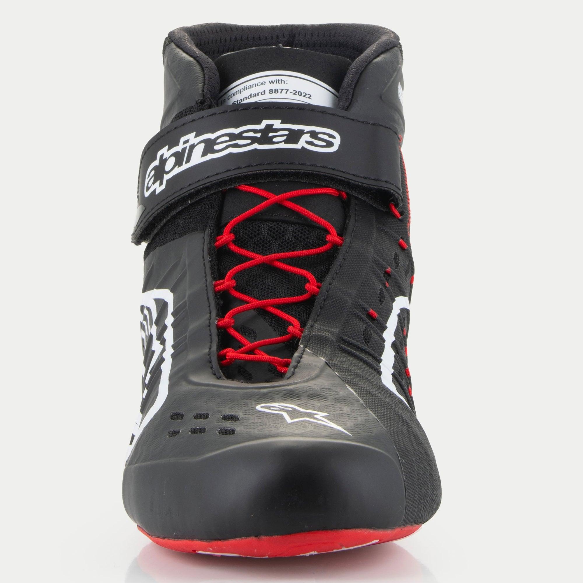 Alpinestars Tech-1 KX V3 Shoes, Karting Shoes, Black White and Red, front view featuring red asymmetric lacing, a black Velcro ankle strap with white branding, and an FIA 8877-2022 certification tag visible on the tongue.