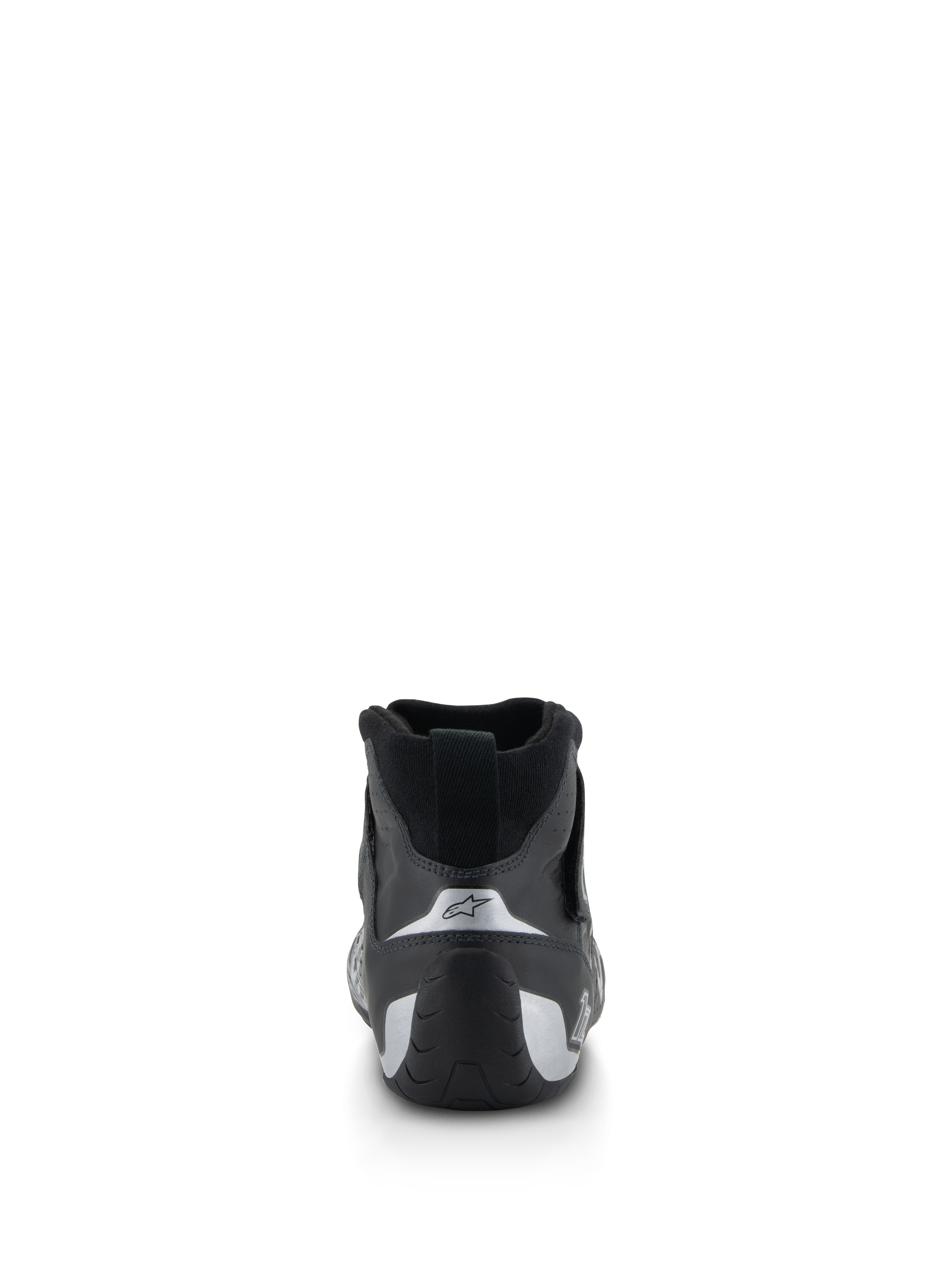 Buty Alpinestars Tech-1 Z V3 FIA, buty wyścigowe, czarno-srebrne, widok z tyłu ukazujący wyprofilowaną piętę ze srebrnymi akcentami i logo gwiazdy, profesjonalne obuwie motorsportowe