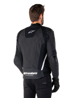 Alpinestars Missile V3 Leather Jacket, Rear view, Black and White, featuring the Alpinestars star logo on the upper back and wordmark on the lower back, protective sliders on elbows and shoulders, premium leather racing gear
