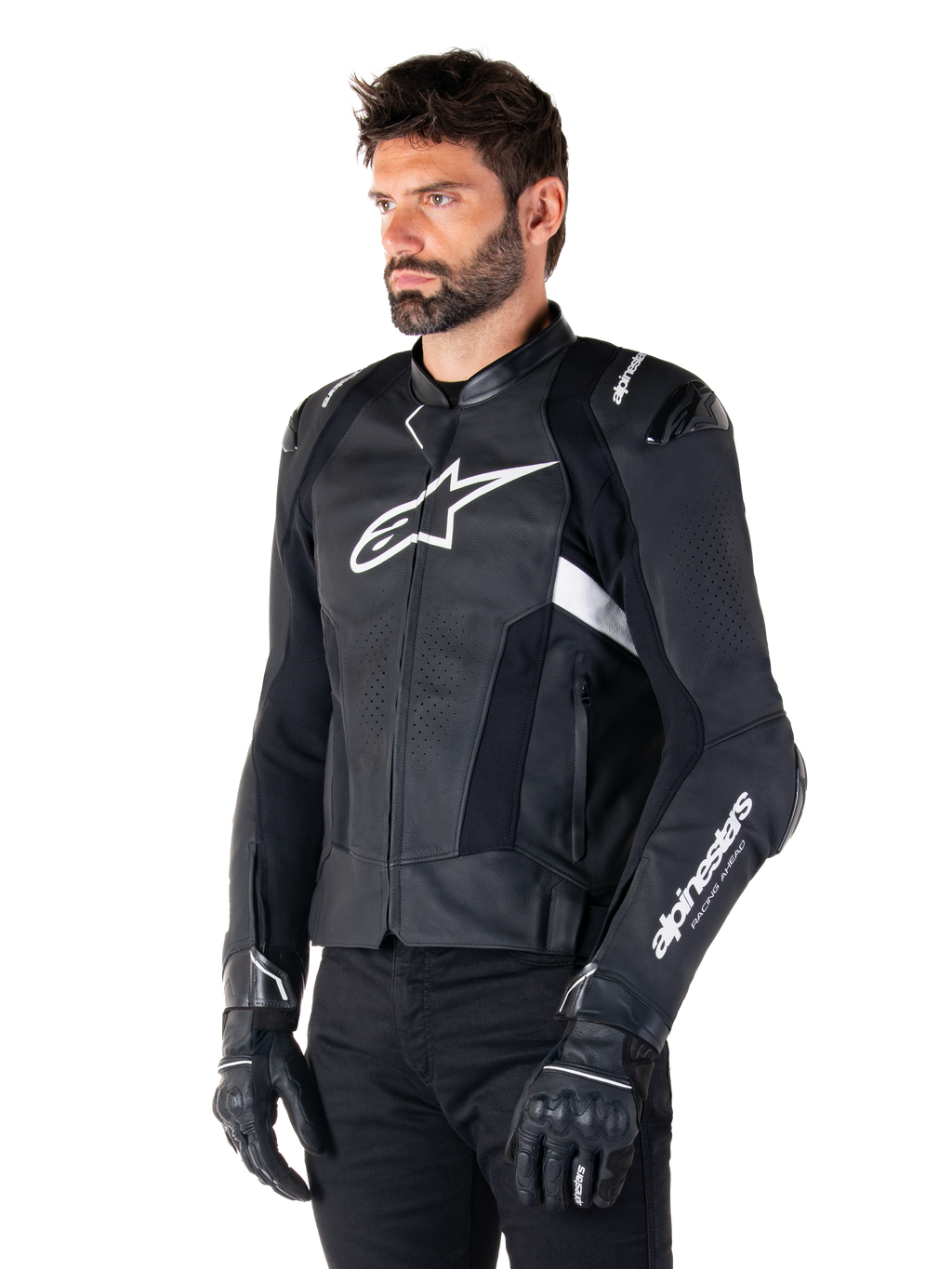 Man wearing the Alpinestars Missile V3 Airflow Leather Jacket, Black and White motorcycle jacket, premium perforated leather for airflow, white Alpinestars logo on chest and sleeve, racing-inspired sport fit, worn with black gloves and pants.