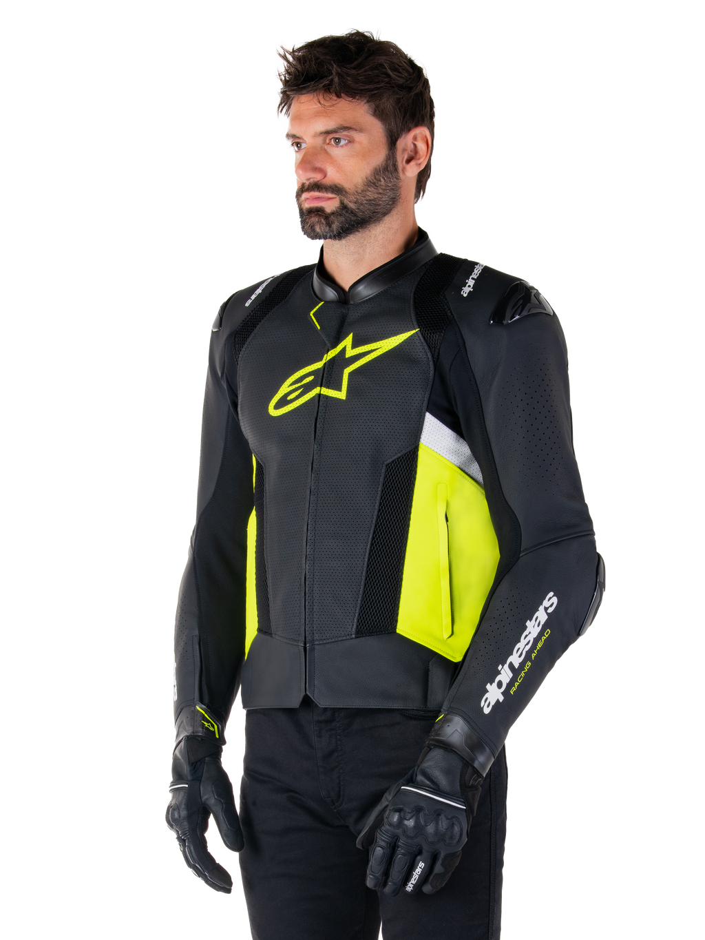 Męski model w skórzanej kurtce Alpinestars Missile V3 Airflow, czarna z żółtymi fluo i białymi akcentami, perforowana skóra dla maksymalnej wentylacji, wyraźne żółte logo na klatce piersiowej, czarne rękawice i spodnie, sportowa odzież motocyklowa
