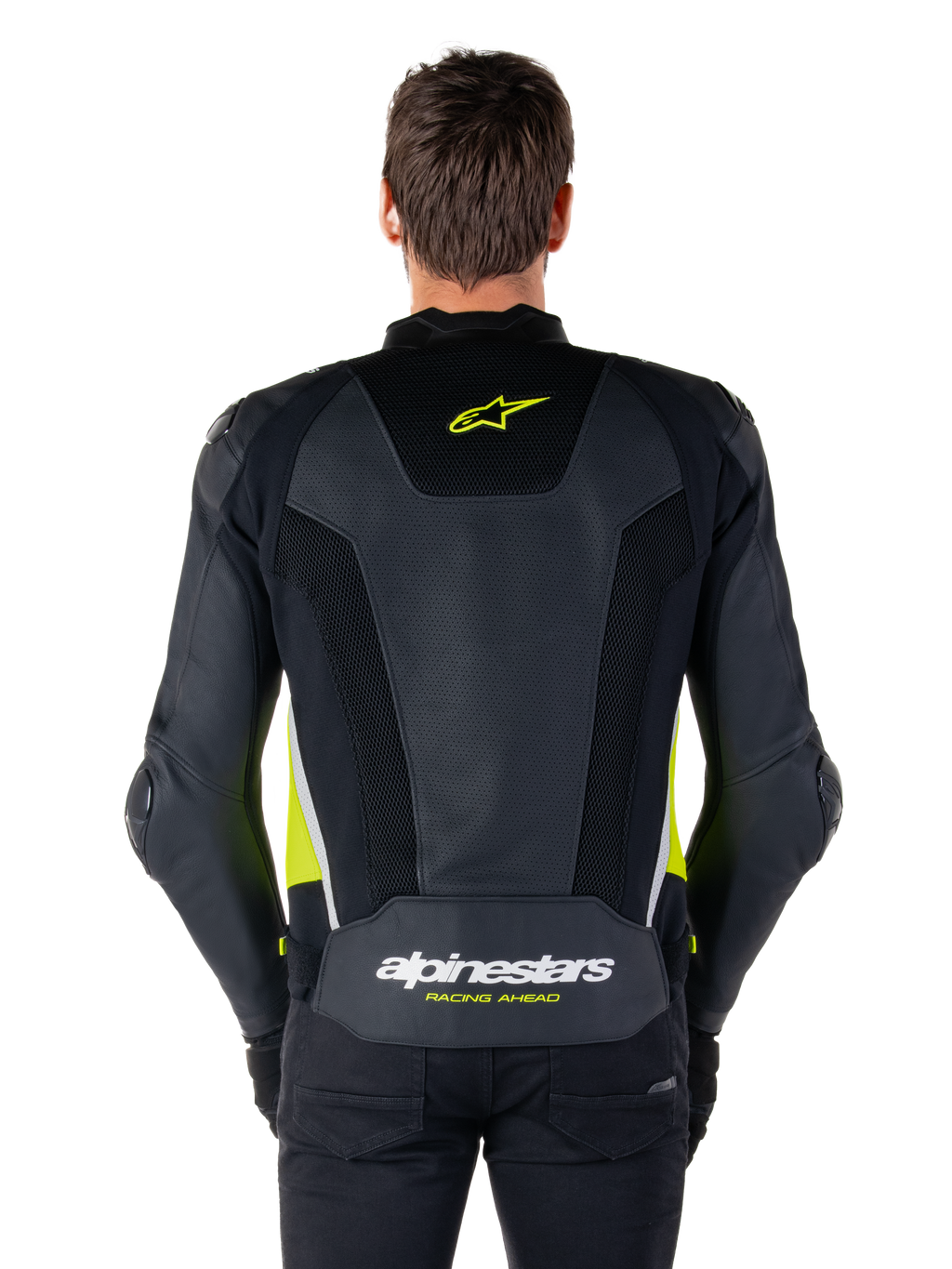 Skórzana kurtka Alpinestars Missile V3 Airflow, widok z tyłu, czarna z żółtymi fluo i białymi akcentami, obszerne panele z perforowanej skóry dla lepszego chłodzenia, logo Alpinestars w górnej i dolnej części pleców, sportowa kurtka motocyklowa inspirowana wyścigami