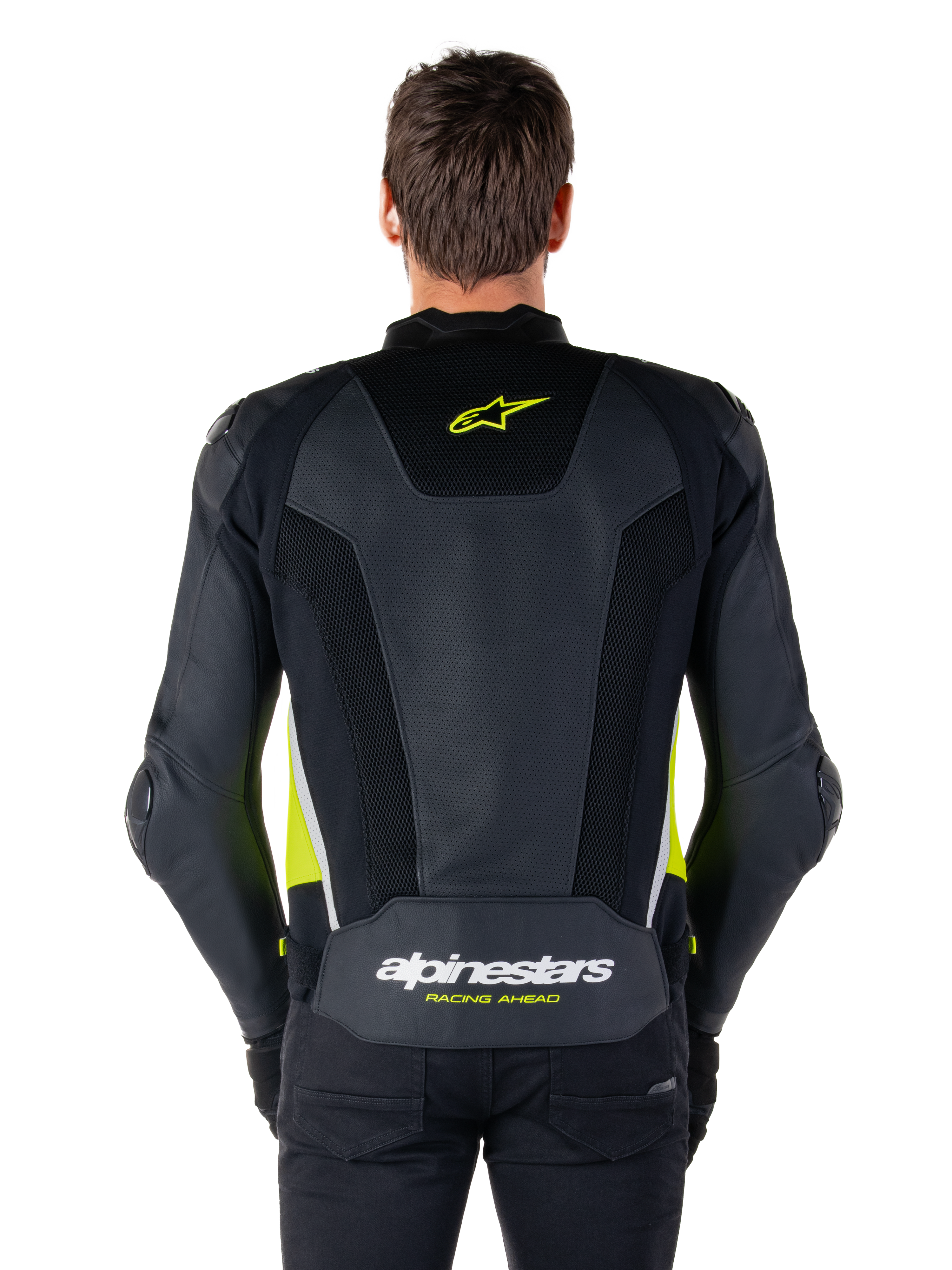 Skórzana kurtka Alpinestars Missile V3 Airflow, widok z tyłu, czarna z żółtymi fluo i białymi akcentami, obszerne panele z perforowanej skóry dla lepszego chłodzenia, logo Alpinestars w górnej i dolnej części pleców, sportowa kurtka motocyklowa inspirowana wyścigami