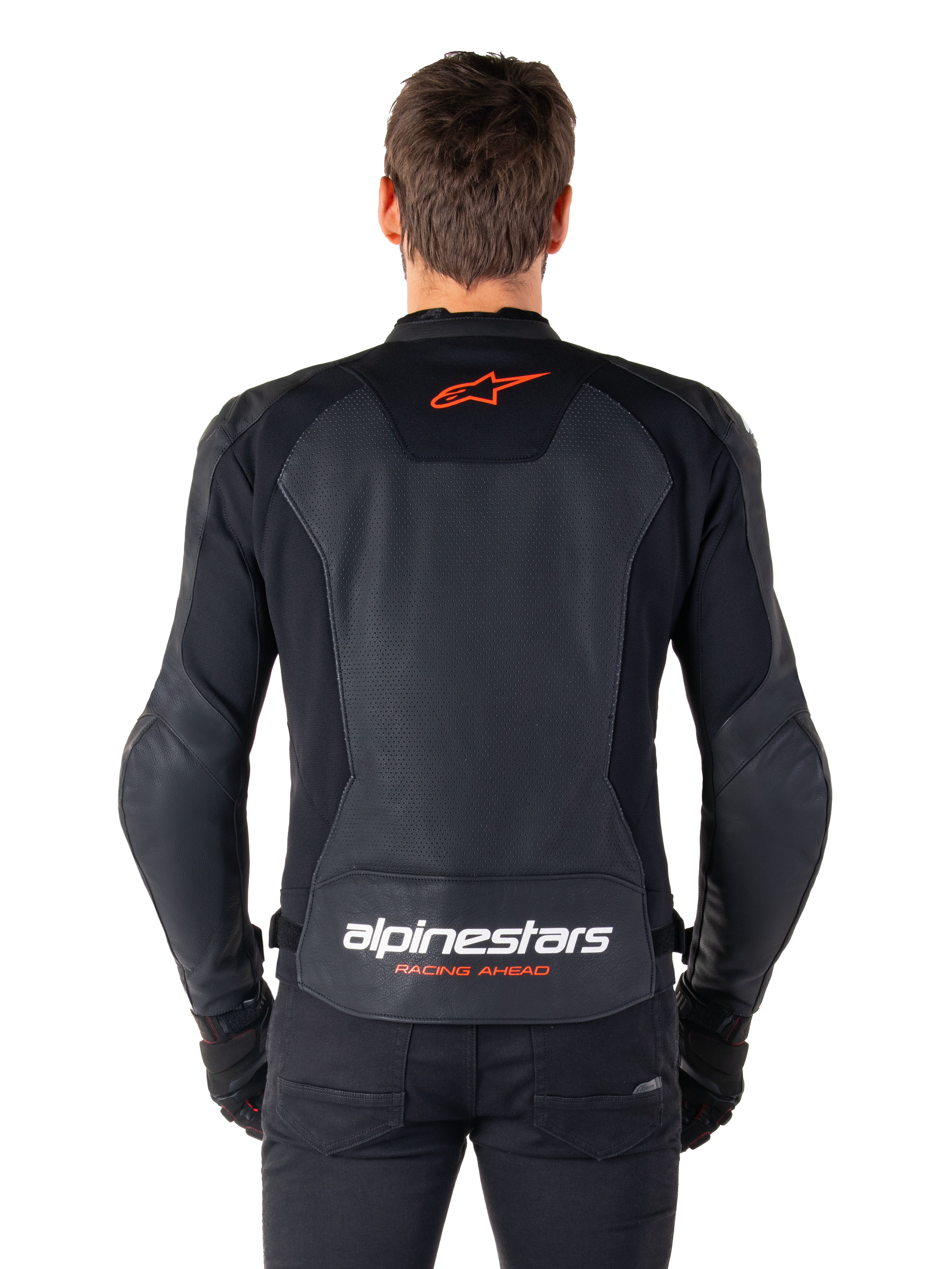 Alpinestars Faster V3 Airflow Leather Jacket, Black, rear view featuring perforated leather panels for ventilation, red Alpinestars star logo, and white branding on the lower back, worn with black pants and gloves.