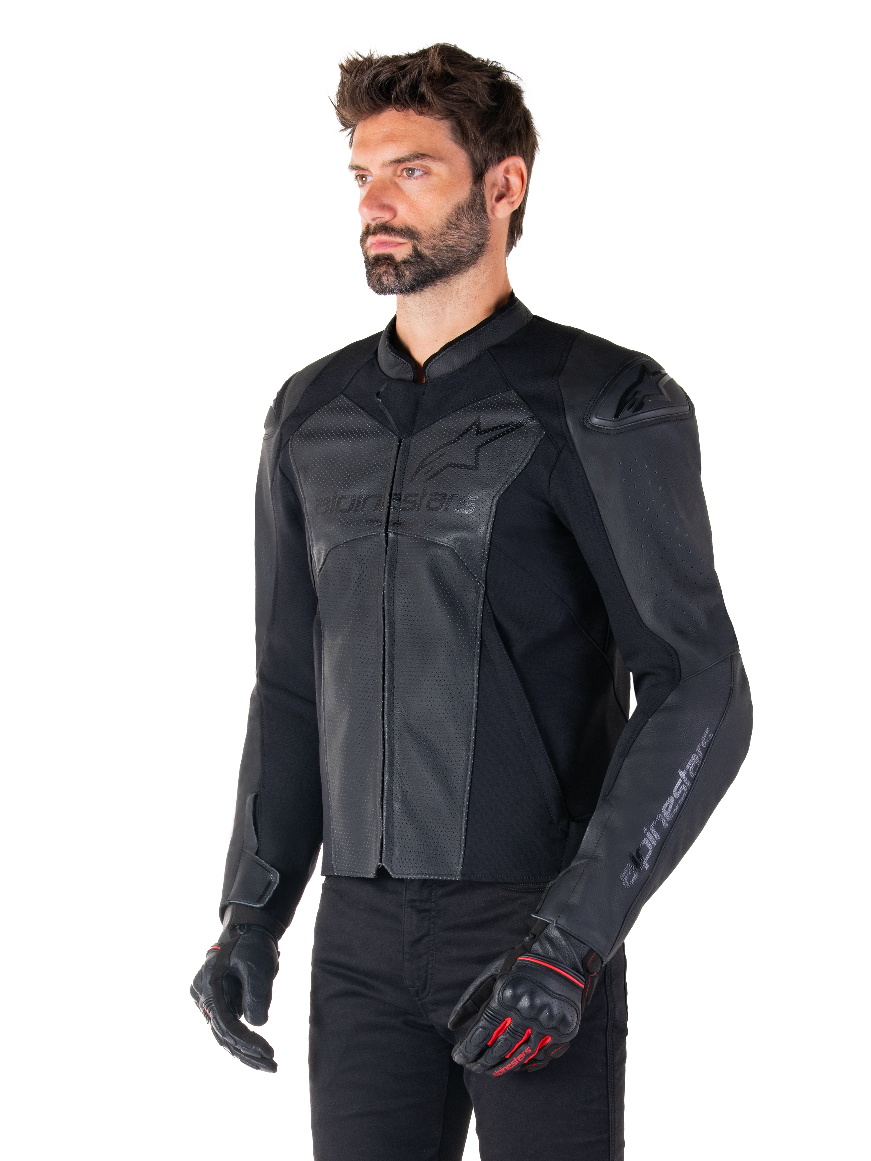 Model wearing the Alpinestars Faster V3 Airflow Leather Jacket in Black Black, sport riding motorcycle jacket with perforated leather and stretch panels, paired with black pants and black gloves with red accents, sleek race-derived style.