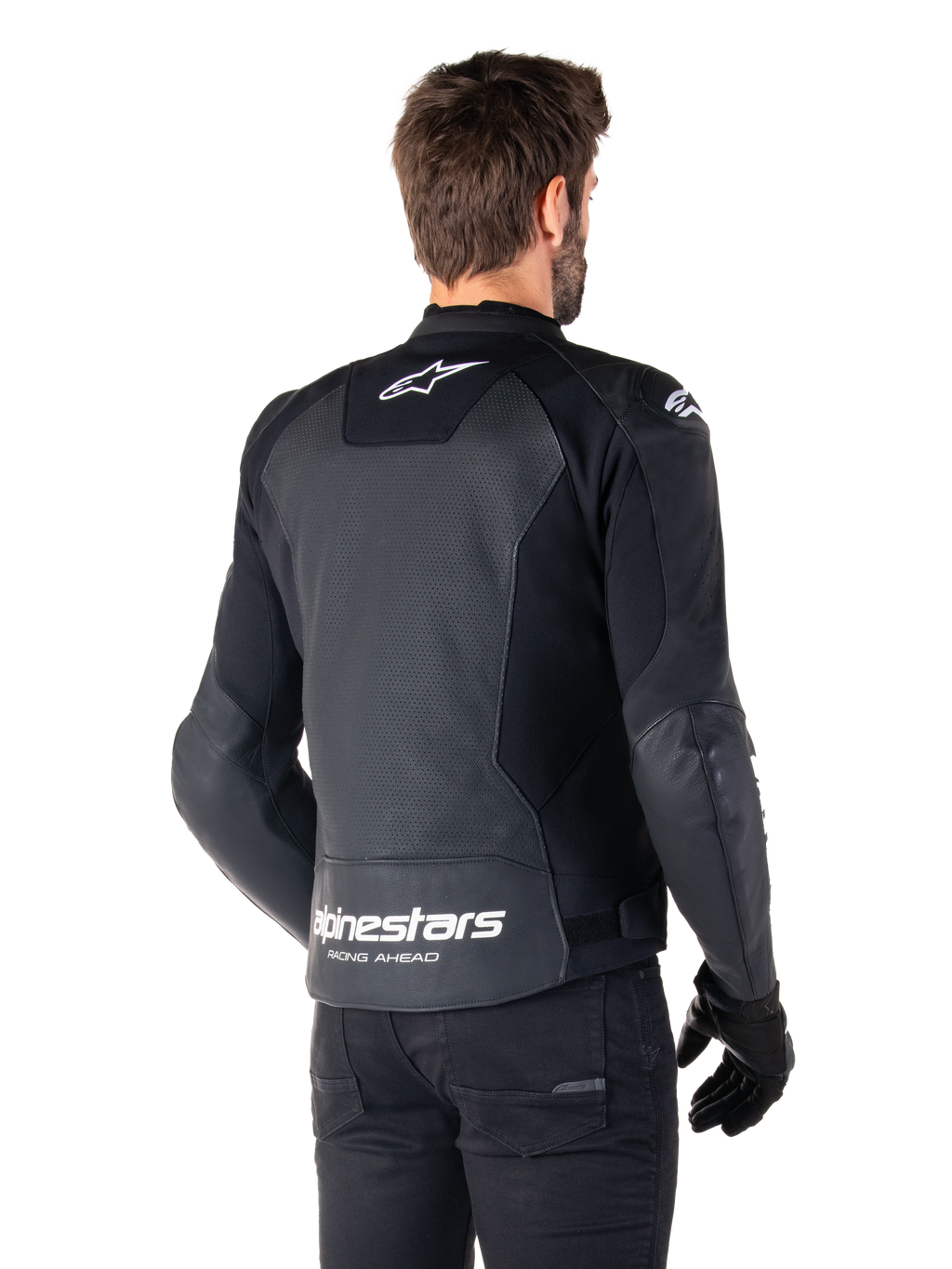 Alpinestars Faster V3 Airflow Leather Jacket, Black and White, rear view on a model, featuring perforated leather back for ventilation, white Astars logos on the upper back and lower waist with 'Racing Ahead' text, sporty design with stretch panels for motorcycling.