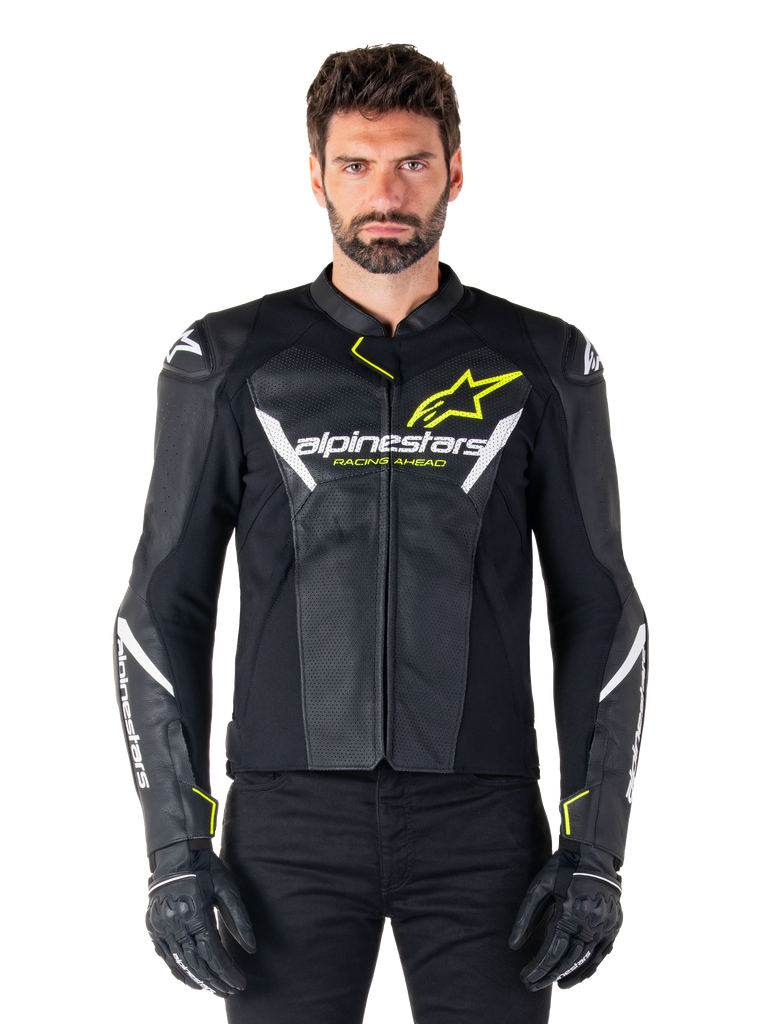 Alpinestars Faster V3 Airflow Leather Jacket, Black White and Yellow Fluo, worn by a male model with matching black gloves, featuring perforated leather panels for ventilation and bold Alpinestars branding on the chest, sport motorcycle riding gear