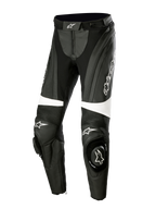 Alpinestars Stella Missile V3 Leather Pants, damskie skórzane spodnie motocyklowe, czarno-białe, elastyczne panele akordeonowe nad kolanami, zintegrowane slidery kolan z logo Alpinestars, białe paski akcentujące, dopasowany krój do jazdy sportowej i torowej