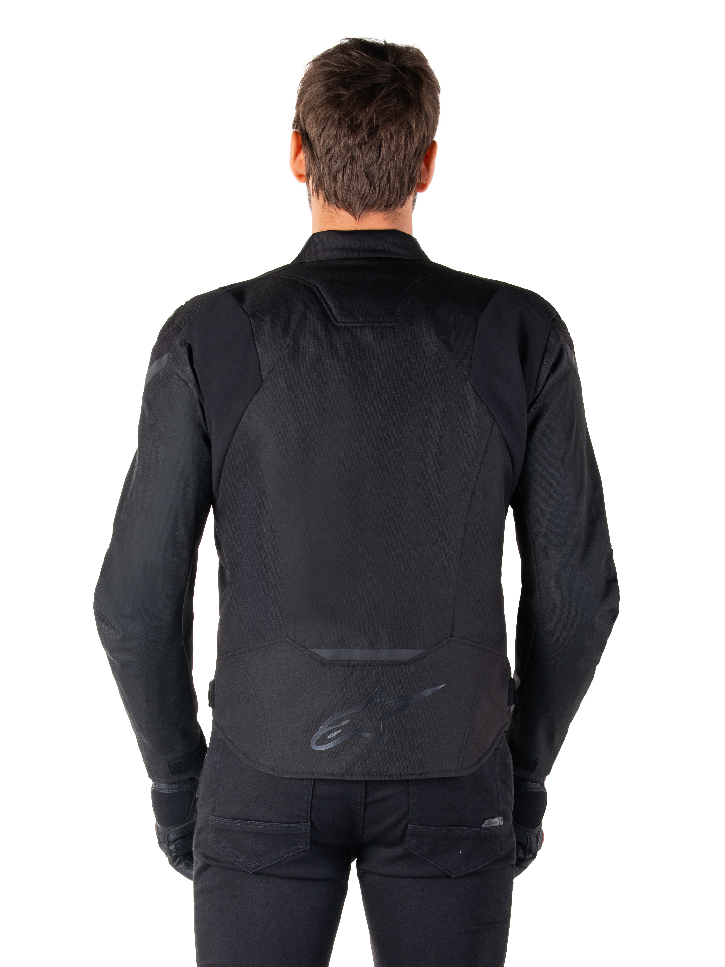 Alpinestars T-Jaws V4 Waterproof Jacket, tekstylna kurtka motocyklowa, czarna, widok z tyłu pokazujący logo Alpinestars w dolnej części pleców, sportowy krój do jazdy szosowej