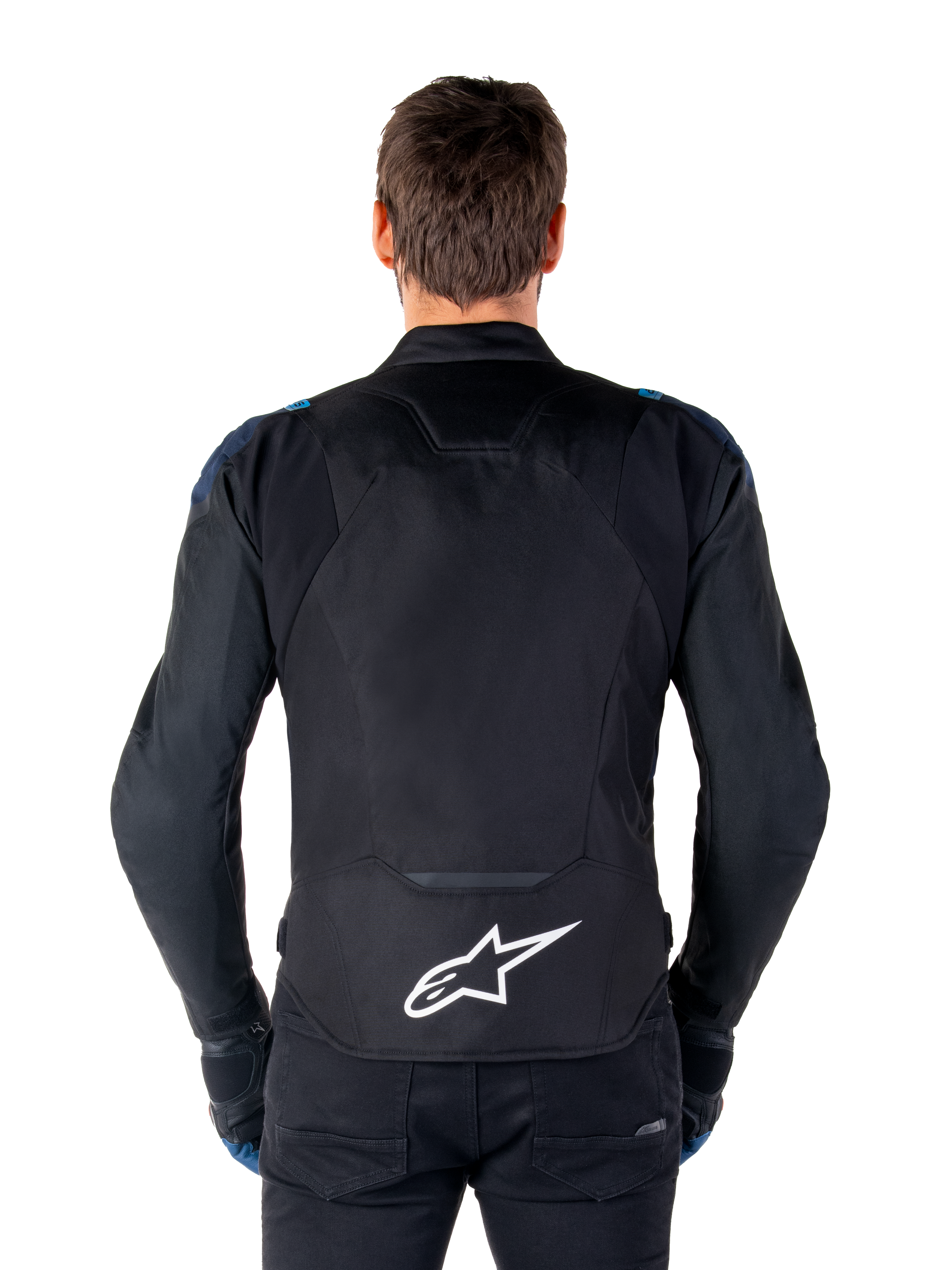 Alpinestars T-Jaws V4 Waterproof Jacket, Motorcycle Jacket, Black Dark Blue Blithe Blue, back view on a model, featuring a large white Alpinestars logo on the lower back, dark blue shoulder accents, and a sleek sport silhouette.