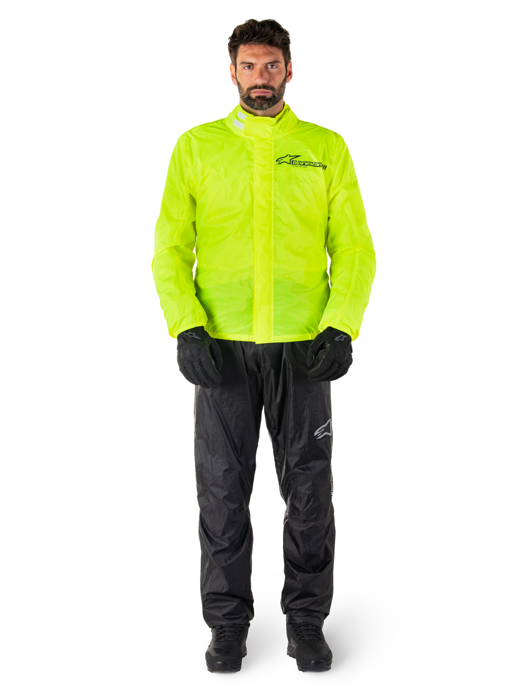 Kurtka i spodnie Alpinestars Hurricane Rain V2, neonowożółty i czarny wodoodporny motocyklowy kombinezon przeciwdeszczowy, czarne rękawice i buty, logo Alpinestars na klatce piersiowej i nogawce
