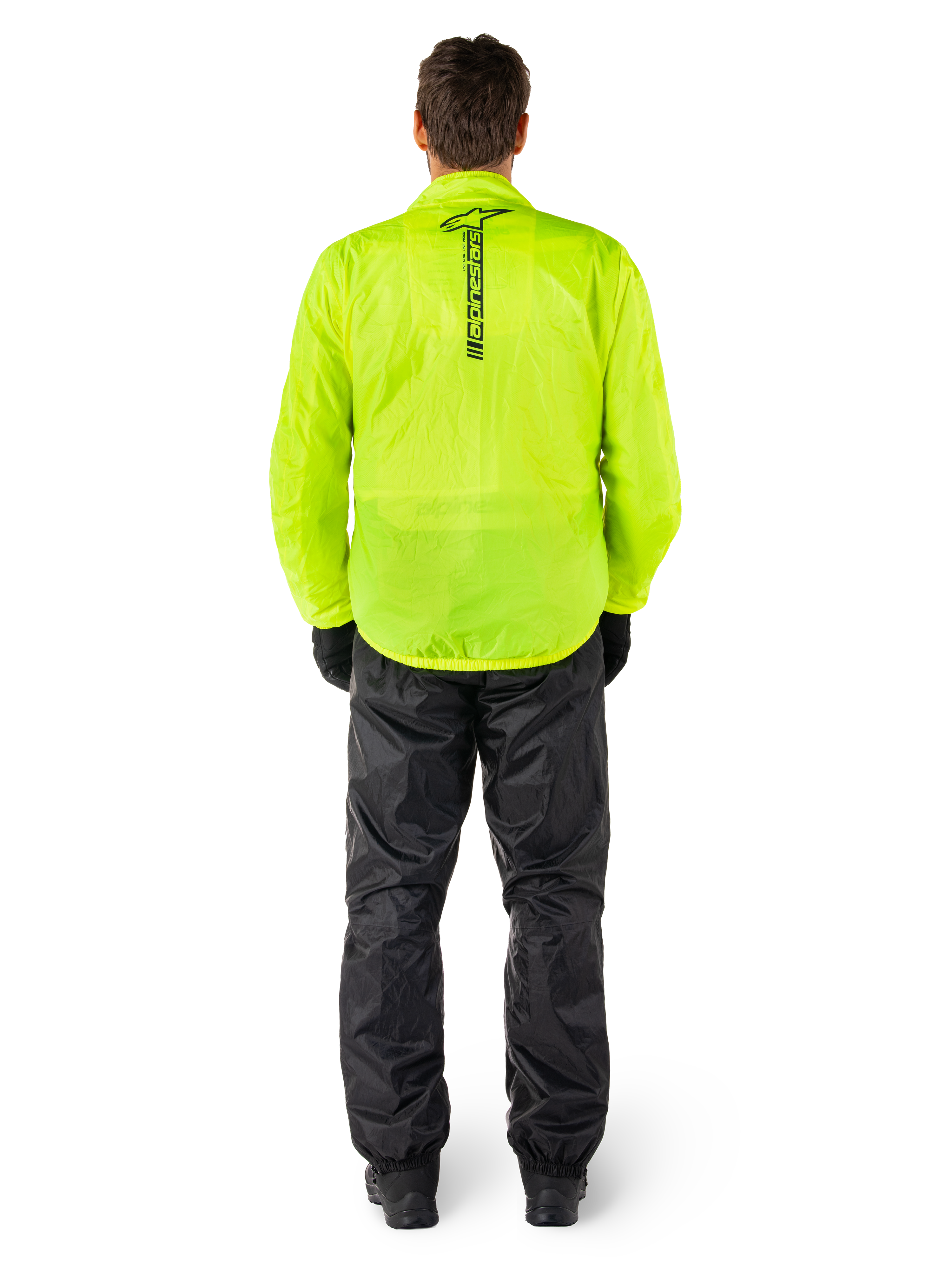 Alpinestars Hurricane Rain V2 Jacket and Pants, wodoodporny motocyklowy kombinezon przeciwdeszczowy, jaskrawożółta kurtka fluorescencyjna z pionowym czarnym logo na plecach, czarne spodnie, lekki materiał tekstylny zapewniający ochronę podczas jazdy w deszczu