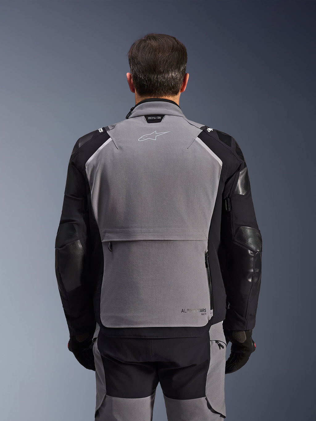 Alpinestars Andes Pro Drystar® XF Jacket, Rear View, Dark Gray and Black, adventure touring jacket featuring a large rear storage pocket, Tech-Air® Ready branding on the collar, and reinforced elbow panels.