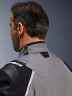Alpinestars Andes Pro Drystar® XF Jacket, Dark Gray and Black, close-up of the back collar and upper shoulder, showing the Tech-Air® Ready logo, shock cord adjustment, and tonal Alpinestars star logo on technical textile