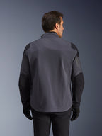 Alpinestars Maxdura Drystar®XF Laminated Armored Shell, technical adventure jacket, Deep Gray and Black, rear view featuring reinforced shoulder and elbow panels, subtle logo on the upper back, worn with black gloves and pants, engineered for all-weather protection