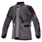 Kurtka Alpinestars Monteira Drystar XF, motocyklowa kurtka turystyczna, ciemnoszara i szara z czarnymi panelami i jaskrawoczerwonymi akcentami, przednie kieszenie cargo, regulowane paski w talii i na rękawach, pionowy napis Alpinestars, wysoki kołnierz, przeznaczona do jazdy adventure