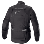 Kurtka Alpinestars Bogotá Pro Drystar®, widok z tyłu, czarna, tekstylna kurtka motocyklowa z dużym panelem wentylacyjnym na plecach, logo Alpinestars, brandingiem „TECH TOURING”, regulowanymi paskami w talii i panelami harmonijkowymi na łokciach.