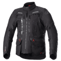 Alpinestars Bogota Pro Drystar Jacket, czarna turystyczna kurtka motocyklowa, szare i czerwone akcenty, duże panele wentylacyjne na klatce piersiowej, wodoodporne kieszenie z czerwonymi uchwytami zamków, wysoki kołnierz ochronny, trwała tekstylna konstrukcja do jazdy typu adventure