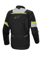 Alpinestars Bogota' Pro Drystar®, męska wodoodporna kurtka adventure touring, czarna i żółta fluo, widok z tyłu.
