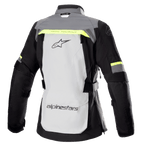 Alpinestars Women Stella Bogota' Pro Drystar® Jacket, Rear View, Ice Gray and Dark Gray with Fluorescent Yellow accents, features a large back logo, 'Tech Touring' text, vertical ventilation zippers, and reinforced accordion panels on the elbows.