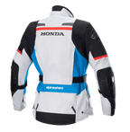 Damska kurtka Alpinestars Stella Honda Andes V3 Drystar®, widok z tyłu, kolor lodowo-szary z niebieskimi i jaskrawoczerwonymi akcentami, wyraźne czarne logo HONDA na plecach, logo Alpinestars na ramieniu i w dolnej części pleców, regulowany pas w talii, tekstylna motocyklowa kurtka turystyczna adventure