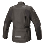 Kurtka damska Alpinestars Stella Andes V3 Drystar®, czarna i ciemnoszara, widok z tyłu przedstawiający wodoodporną konstrukcję tekstylną, dużą kieszeń w dolnej części pleców, regulowany pasek w talii oraz odblaskowe elementy bezpieczeństwa.