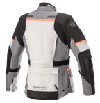 Alpinestars Stella Andes V3 Drystar® Jacket, damska kurtka motocyklowa, kolor lodowy szary, ciemnoszary, czarny i koralowy, widok z tyłu z dużą kieszenią na dole pleców, regulowanym pasem w talii i koralowymi akcentami na ramionach i plecach.