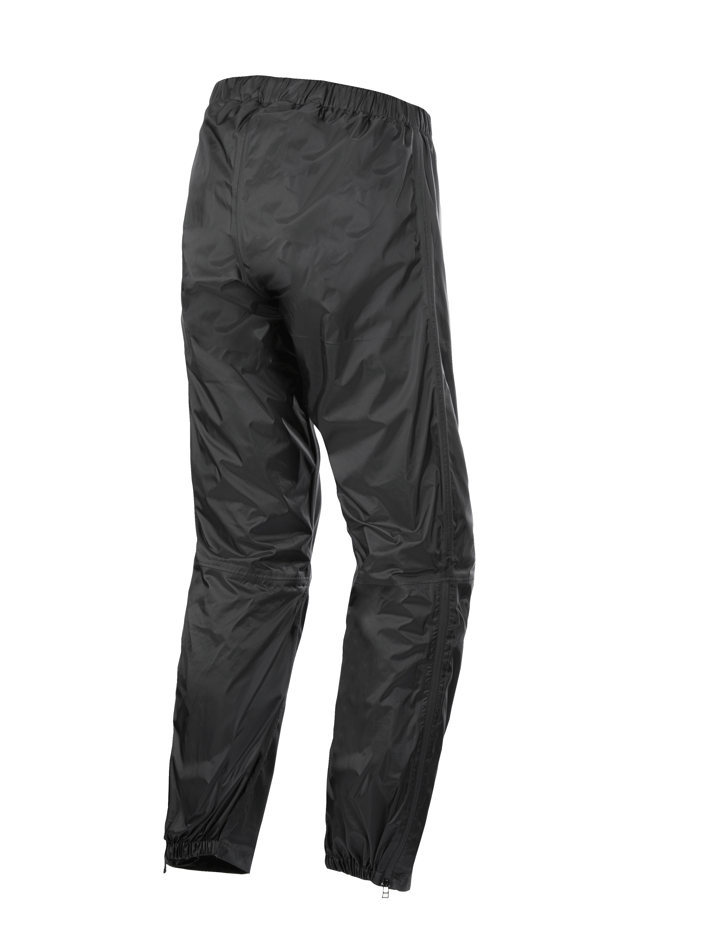Alpinestars Hurricane Rain V2 Pant, wodoodporne spodnie motocyklowe, czarne, widok z tyłu prezentujący elastyczny pas i mankiety, lekka wiatroszczelna laminowana tkanina z zamkami na dole nogawek ułatwiającymi zakładanie butów, odzież ochronna do turystyki szosowej i adventure
