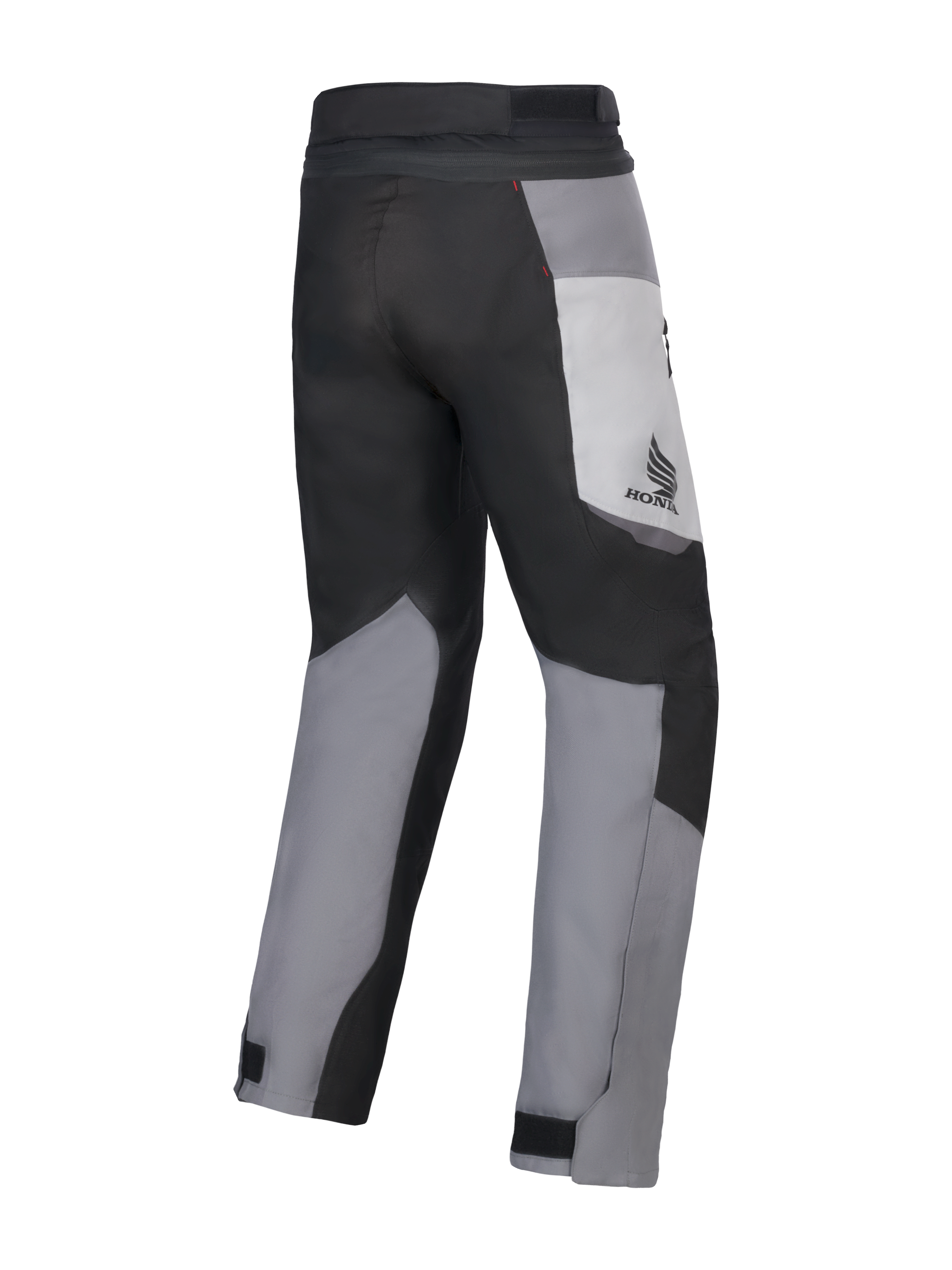 Spodnie Alpinestars Honda St-1 Waterproof, motocyklowe spodnie turystyczne, w kolorach Ice Gray, Dark Gray i czarnym, widok z tyłu ukazujący wielopanelową konstrukcję tekstylną, logo Honda na udzie i regulowane zapięcia na kostkach do jazdy w każdą pogodę.