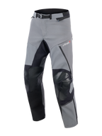 Alpinestars Andes Pro Drystar® XF Pants, Adventure Touring Motorcycle Pants, Dark Gray and Black, featuring reinforced black knee and inner leg panels, magnetic waist buckle, and Drystar XF logo on the thigh, technical textile design for extreme weather.