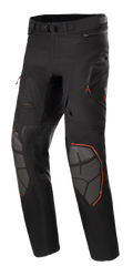 Alpinestars AMT-10R Drystar XF, spodnie motocyklowe adventure touring, czarne z pomarańczowymi akcentami, szare wzmocnienia kolan Superfabric, regulowany pas, kieszenie na zamki błyskawiczne, wodoodporna laminowana konstrukcja