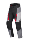 Alpinestars Honda Woman Stella ST-1 Waterproof Pants, Women's Motorcycle Touring Pants, Ice Gray, Dark Gray, and Black with Red accents, featuring zippered cargo pockets, ergonomic textile construction, and adjustable waist.