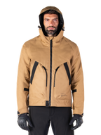 Alpinestars Morush Waterproof Parka, Motorcycle Jacket, Utility Brown, hooded streetwear-inspired design with large black-accented front pockets, worn with black riding gloves and pants, urban contemporary motorcycle gear