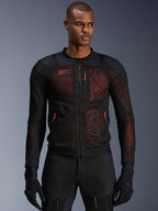 Alpinestars Troop-Air Pro Jacket, technical armored motorcycle jacket, Black and Red Fluo, featuring red zipper pulls and Alpinestars logo, breathable mesh panels with red underlay, worn with matching black riding pants and gloves