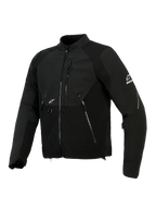 Kurtka Alpinestars Provoke, tekstylna kurtka motocyklowa, czarna, posiada panele softshell ripstop, laserowo perforowaną strefę klatki piersiowej, kieszenie na zamek, białe logo Alpinestars na rękawie i klatce piersiowej, miejska odzież motocyklowa