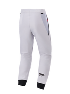 Alpinestars Aeroshell Airflow Pants, widok z tyłu, średnioszare techniczne spodnie motocyklowe softshell, czarne siatkowe panele na biodrach i elastyczne mankiety, czarne logo ASTARS na nogawce, lekka i wentylowana konstrukcja sportowa