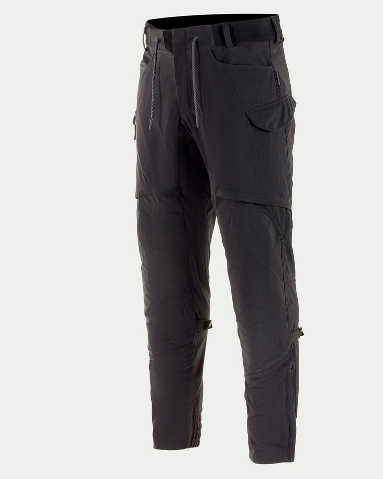 Alpinestars Juggernaut Riding Pants, Urban Motorcycle Pants, Black, featuring an elasticated waist with drawstrings, cargo pockets, thigh vents, and softshell construction, designed for road riding and weather protection.