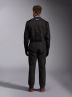 Alpinestars KMX-9 V3 Suit, Karting Suit, Black and White, rear view showing white contrast stitching, FIA homologation label on the collar, and stretch panels for mobility