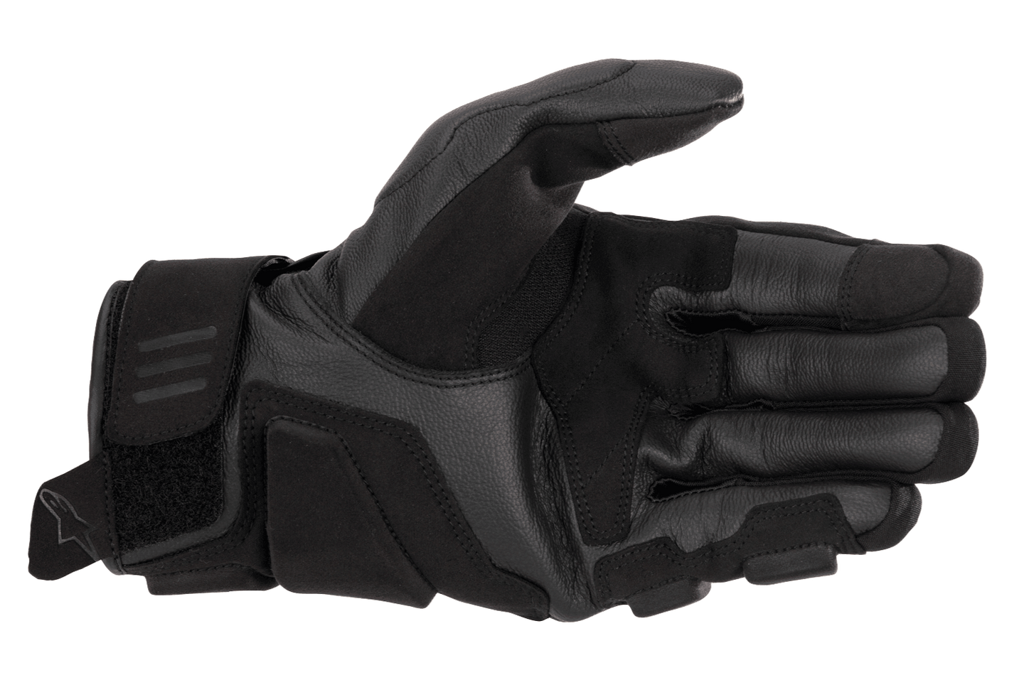 A black and white Alpinestars EU Phenom Leather Glove displaying the palm side, highlighting protective knuckle padding, perforated leather for breathability, and a Velcro strap at the wrist for a secure fit. The Alpinestars logo is visible on the side of these sport performance gloves.