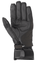 Alpinestars Andes V3 Drystar® Glove, czarna rękawica motocyklowa, widok od strony dłoni z konstrukcją ze skóry koziej i materiału tekstylnego, wzmocniony obszar dłoni, regulowany pasek na nadgarstku z mankietem na rzep, techniczny design turystyczny na każdą pogodę