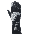 Rękawice Alpinestars Tech-1 ZX V4, rękawice wyścigowe, czarne i antracytowe, z dużym logo gwiazdy na wierzchu dłoni i napisem Alpinestars na długim mankiecie, logo gwiazdy na palcu wskazującym, profesjonalna konstrukcja ognioodporna