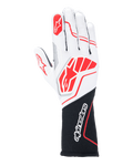 Rękawice Alpinestars Tech-1 ZX V4, rękawice wyścigowe, białe i czarne z czerwonymi akcentami, teksturowana tkanina o strukturze plastra miodu z zewnętrznymi szwami, duże czerwone logo na wierzchu dłoni, czarna przedłużona sekcja nadgarstka z białym napisem Alpinestars
