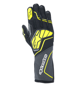 Alpinestars Tech-1 ZX V4 Gloves, Auto Racing Gloves, Tar Gray, Black and Yellow Fluo, featuring a large yellow star logo on the back and white branding on the cuff, honeycomb textured fabric with angular neon accents, professional motorsport gear.