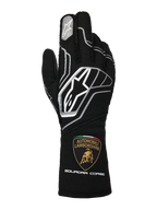 Rękawice Alpinestars Limited Edition Lamborghini Tech-1 ZX V4, czarne z ciemnoszarymi i białymi akcentami, widoczne logo Alpinestars i tarcza Automobili Lamborghini Squadra Corse na mankiecie, profesjonalne rękawice wyścigowe z certyfikatem FIA